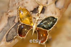 Amber and Gold. Amber in cognac, yellow, green and dark cognac in butterfly design. Butterfly pendant. Golden pendant. Amber jewelry. Unique.