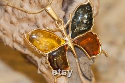 Amber and Gold. Amber in cognac, yellow, green and dark cognac in butterfly design. Butterfly pendant. Golden pendant. Amber jewelry. Unique.