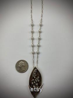 Fine silver hand carved lily of the valley pendant. 5mm white pearls. Leaves. Leaf bale. Wire wrapped pearls. Lobster clasp. America made.
