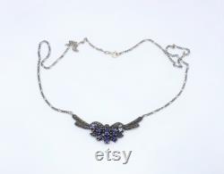 Sterling silver and marcasite necklace set with pear shaped amethysts.