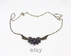 Sterling silver and marcasite necklace set with pear shaped amethysts.