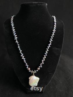 Stunning peacock pearl statement necklace with gorgeous baroque pearl pendant and amethyst and sterling silver accent beads.